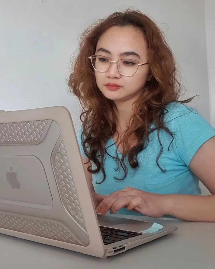 Shaira Urbano, SEO specialist, working at her desk